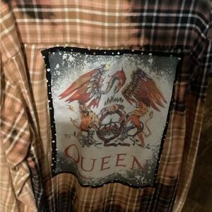 Que Plaid Shirt with Regal Graphic